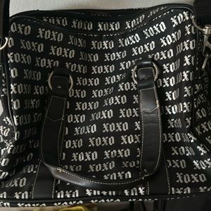 XOXO carry on travel bag, with long strap.2 big pockets, very spacious.